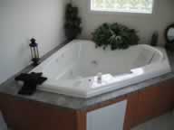 whirlpool tub, glass block window